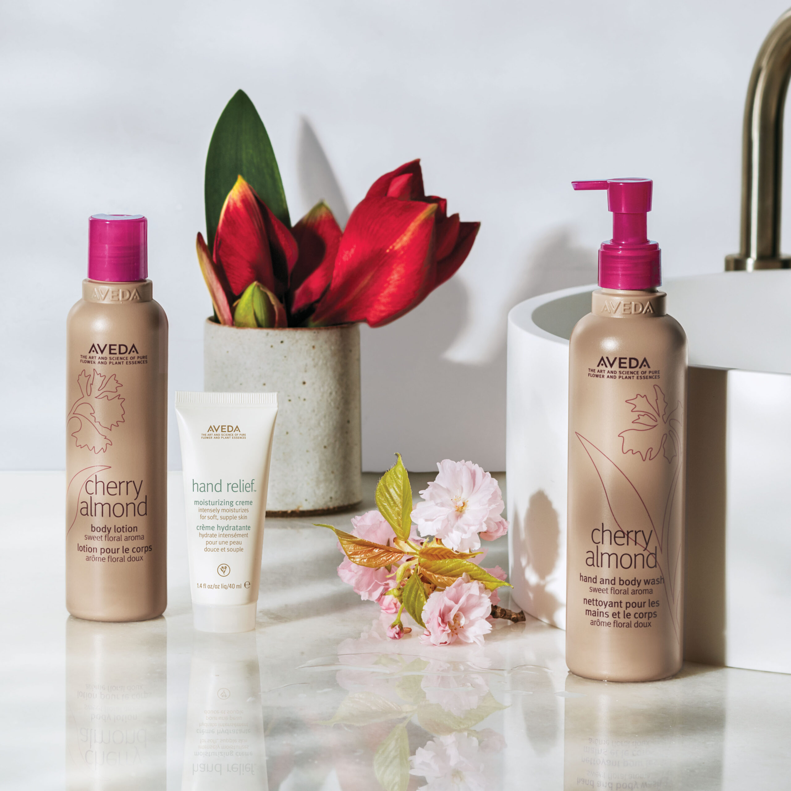 Aveda bottles on display with flowers