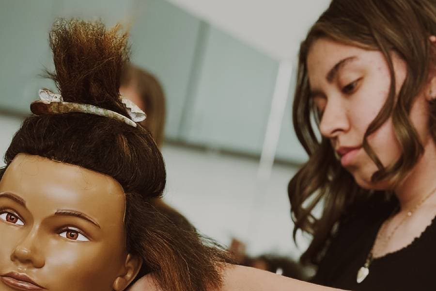 aveda student teaches cosmetologists duties