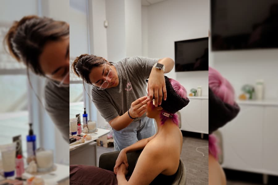 cosmetology licensed instructor applying make up