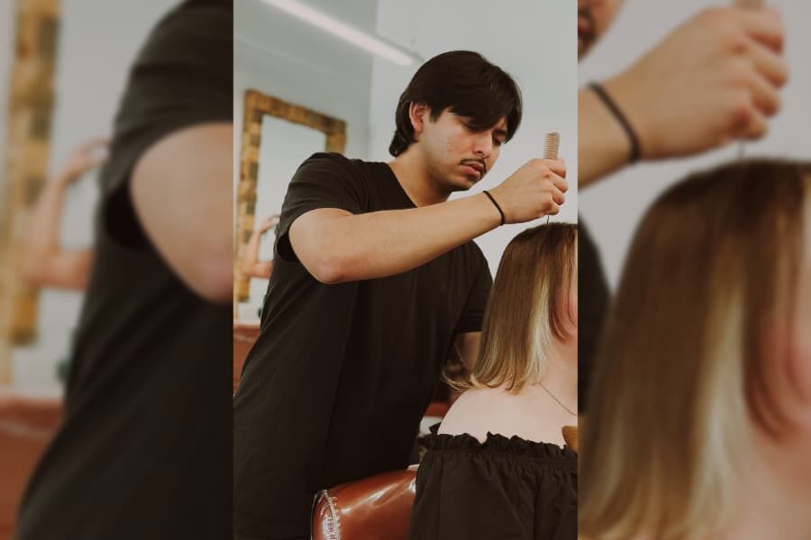 hairstyling student designs hair for bridal event